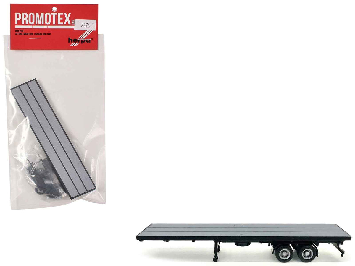 Gray 40ft flatbed trailer plastic model for HO scale by Miniature Motors, detailed miniature accessories for model railroads.