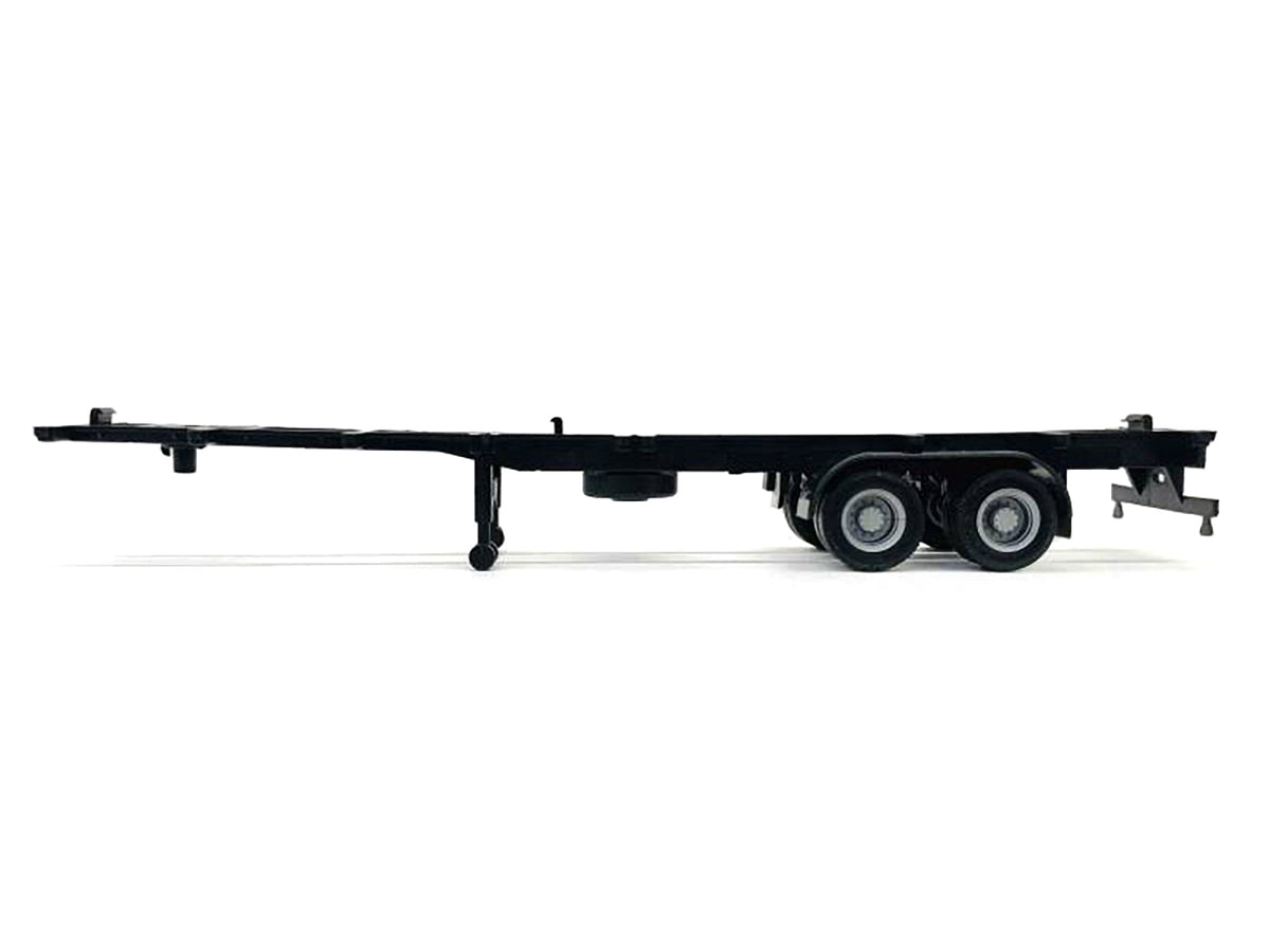 Plastic model container chassis for 2-axle 40ft trailer in HO scale, by Miniature Motors, detailed accessory for model trains.