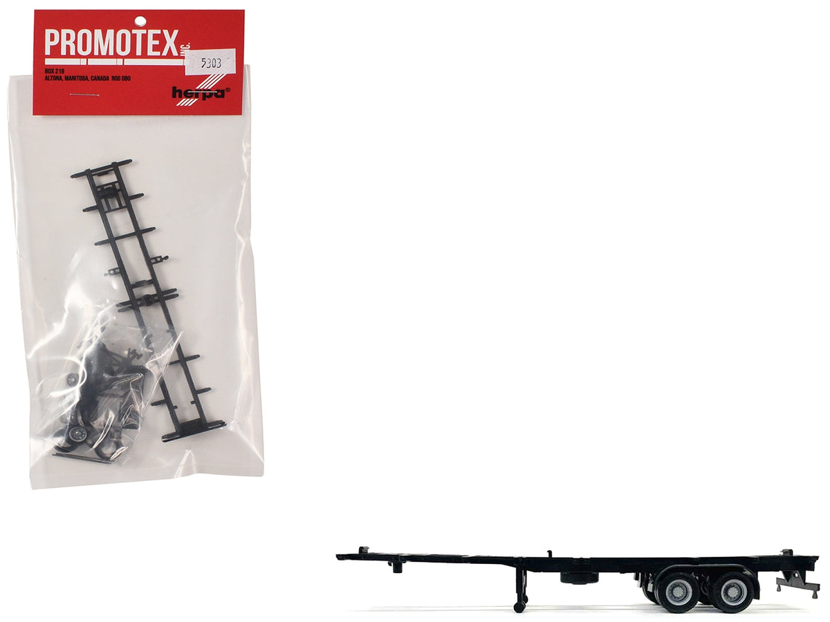 Plastic model container chassis for 2-axle 40ft trailer, HO scale, by Miniature Motors, detailed model accessory for 1/87 trains.