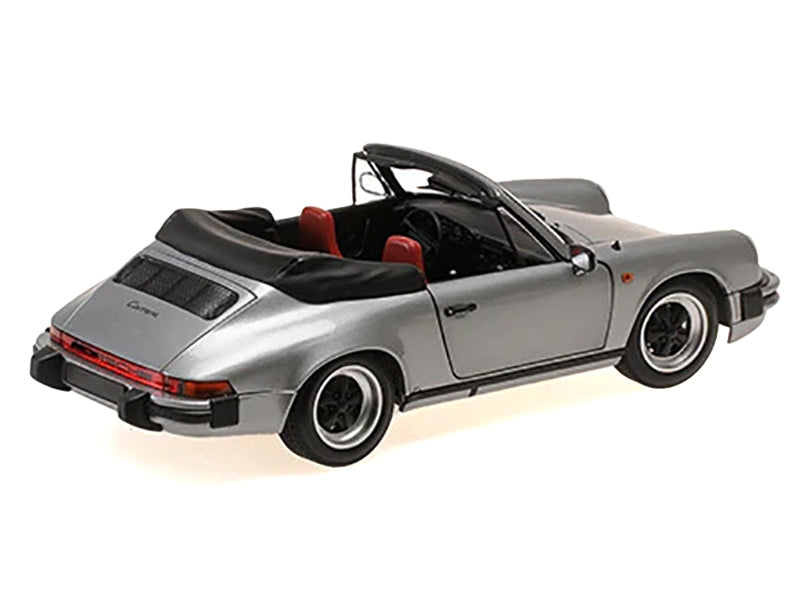 Gray metallic 1/18 scale diecast model of 1983 Porsche 911 Carrera Cabriolet by Minichamps, detailed miniature car.