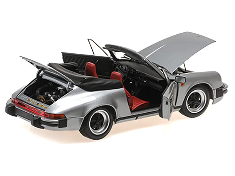 Gray metallic 1983 Porsche 911 Carrera Cabriolet 1/18 diecast model car by Minichamps, detailed miniature Porsche vehicle.