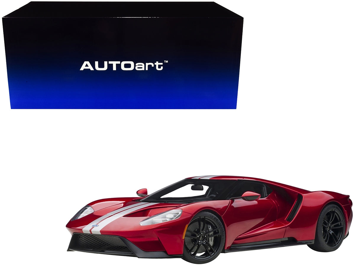 Miniature Ford GT 2017 model car in Liquid Red Metallic with silver stripes by Autoart, detailed 1/12 scale collectible.