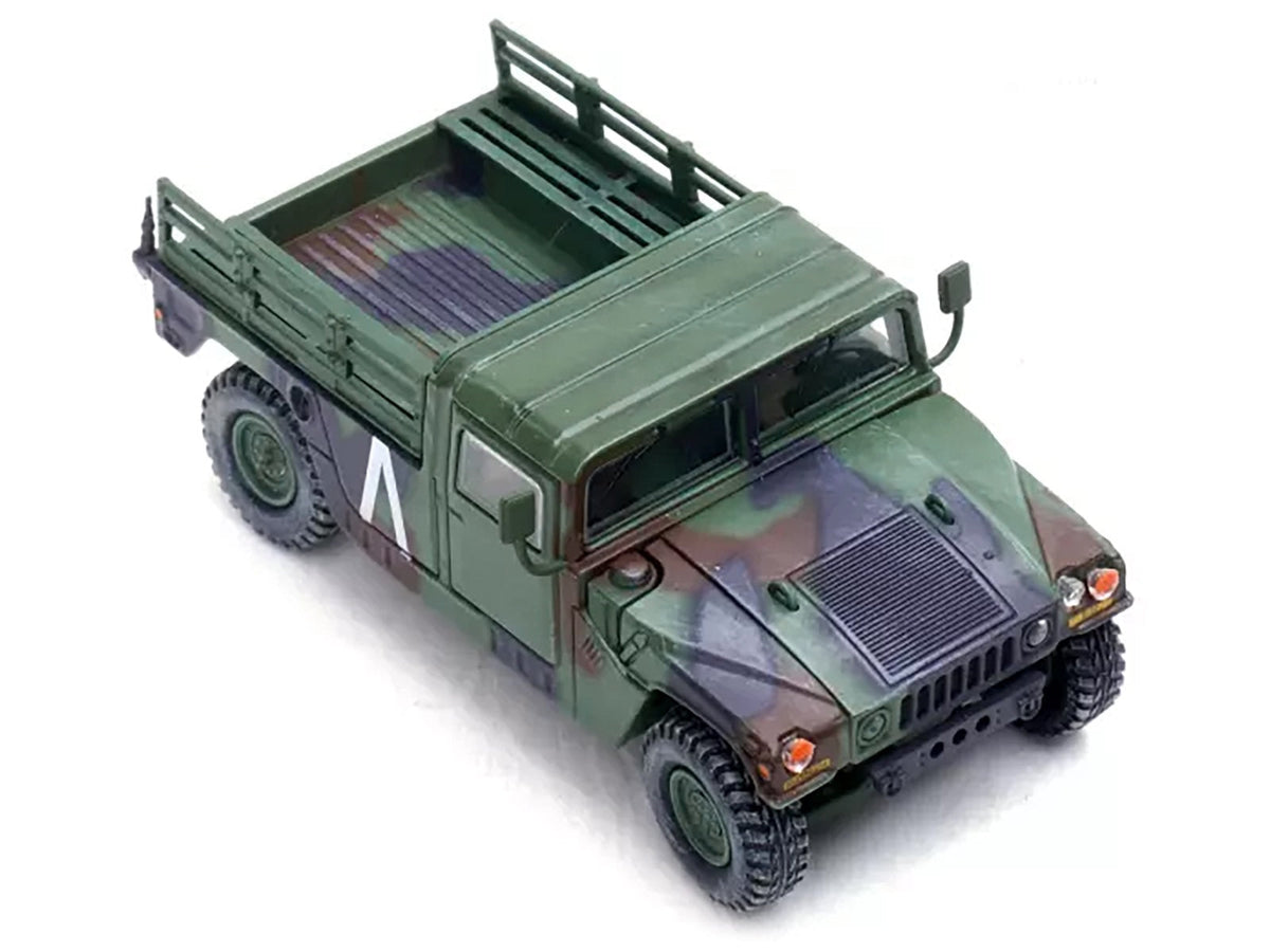 Miniature Motors 1/64 diecast M998 HMMWV military model with 8th Battalion 4th Air Defense Regiment decals, US Army Gulf War era