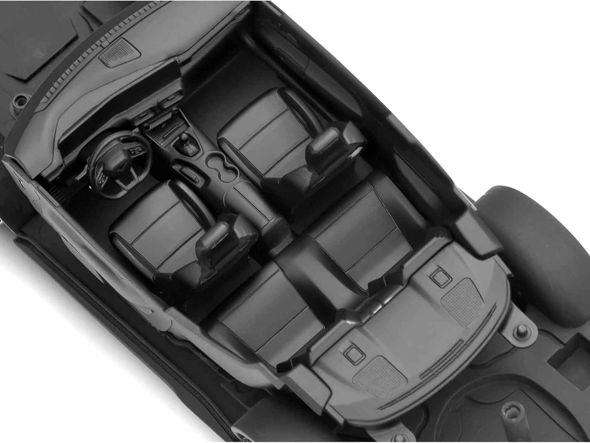 Miniature Motors 1/25 scale Ford Mustang GT Level 3 Model Kit by Revell, featuring detailed parts for assembly and customization.
