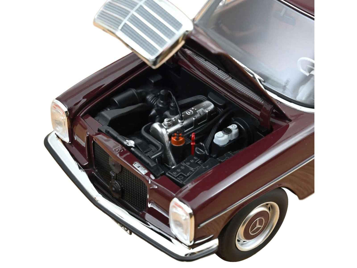 Dark red-brown 1968 Mercedes-Benz 200 diecast model car by Norev, detailed miniature Mercedes model, displayed from side angle