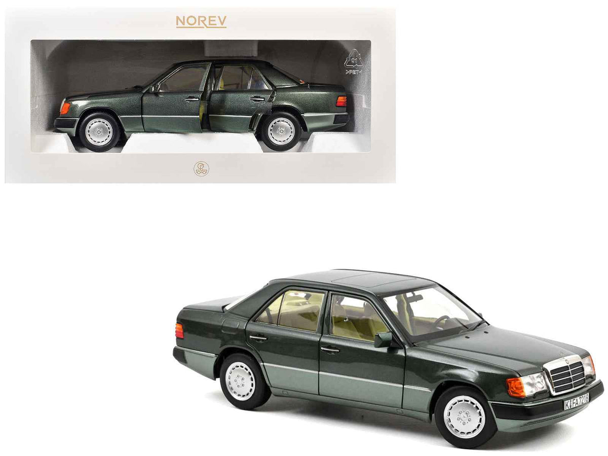 Miniature Mercedes-Benz 230 E diecast model car in night green metallic with green interior, 1/18 scale by Norev.