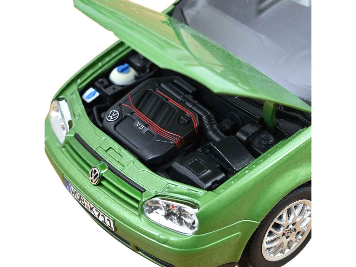 Green metallic 1998 Volkswagen Golf GTI diecast model car by Norev, detailed miniature Volkswagen model in 1/18 scale.