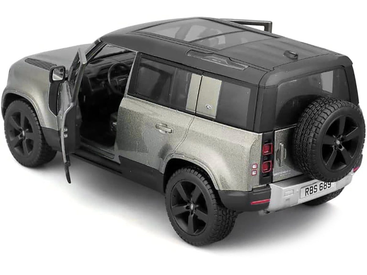 Miniature Motors 2022 Land Rover Defender 110 diecast model in green metallic with black top and sunroof, detailed scale replica.
