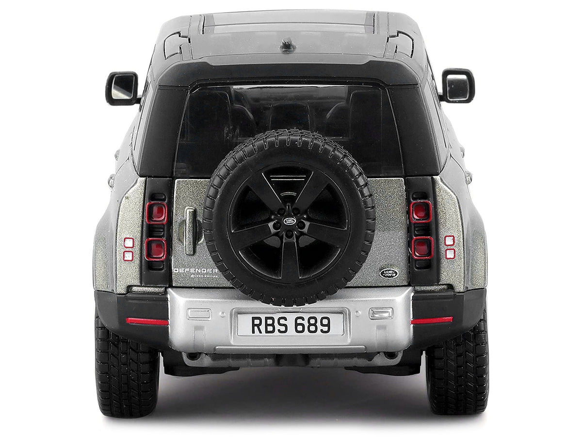 Green metallic 2022 Land Rover Defender 110 diecast model car by Bburago, featuring black roof and sunroof, 1/24 scale.