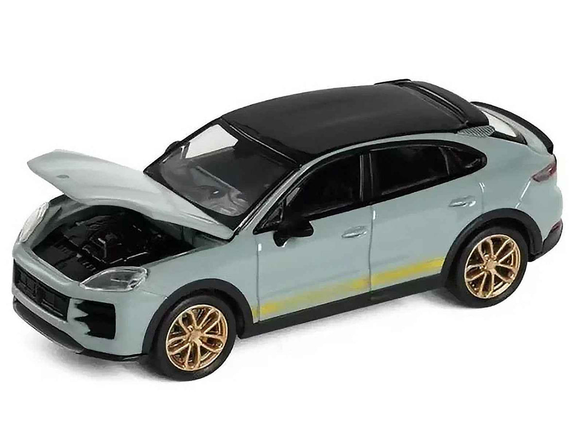 Gray Porsche Cayenne Turbo GT 1/64 diecast model car by Miniature Motors with black top and gold stripes, detailed miniature vehicle.