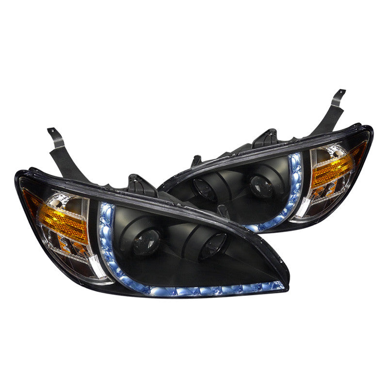 Black Spec-D R8 projector headlights for 2004-2005 Honda Civic with sleek design and clear lenses, featuring modern automotive lighting.