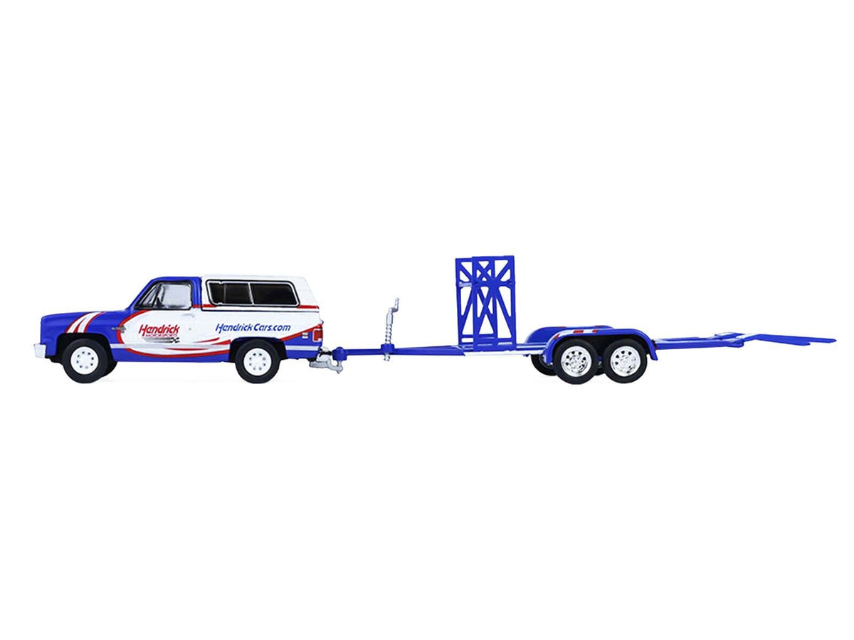 1986 Chevrolet K5 Blazer and 1969 Chevrolet Camaro #5 diecast model cars by Miniature Motors with tandem car trailer, blue and white.