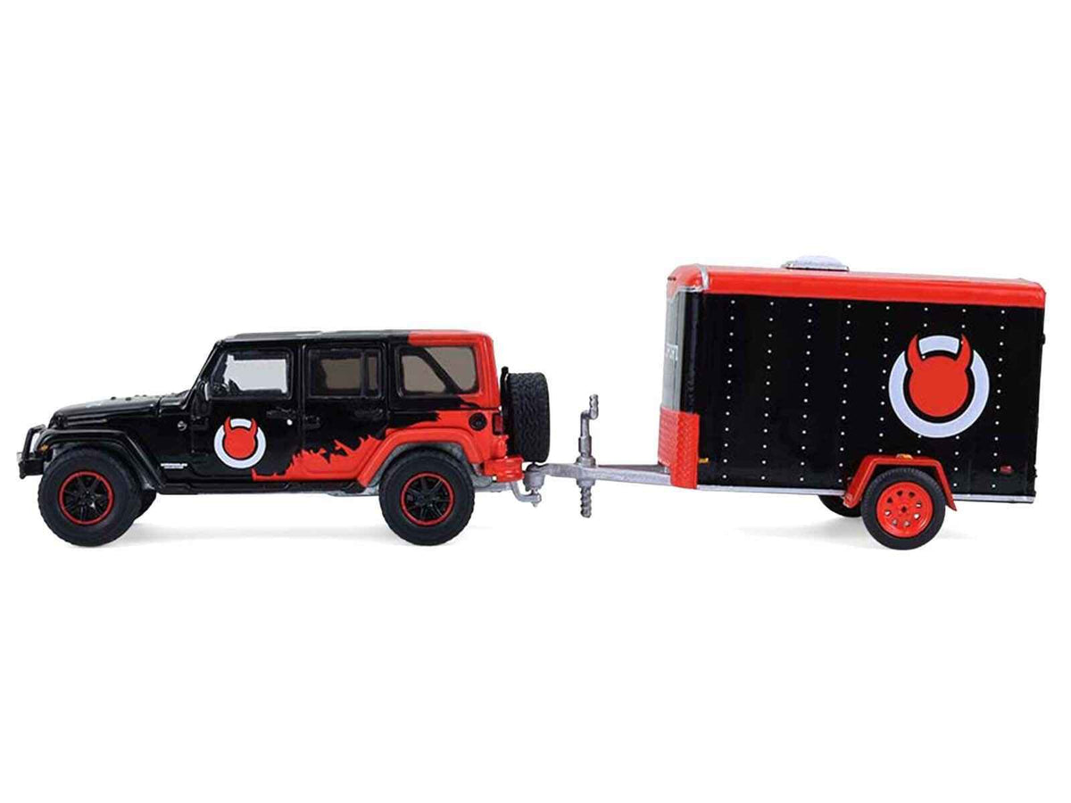 Miniature Motors 2012 Jeep Wrangler Unlimited Diablo Sport diecast model in black with red graphics and small cargo trailer, 1/64 scale.
