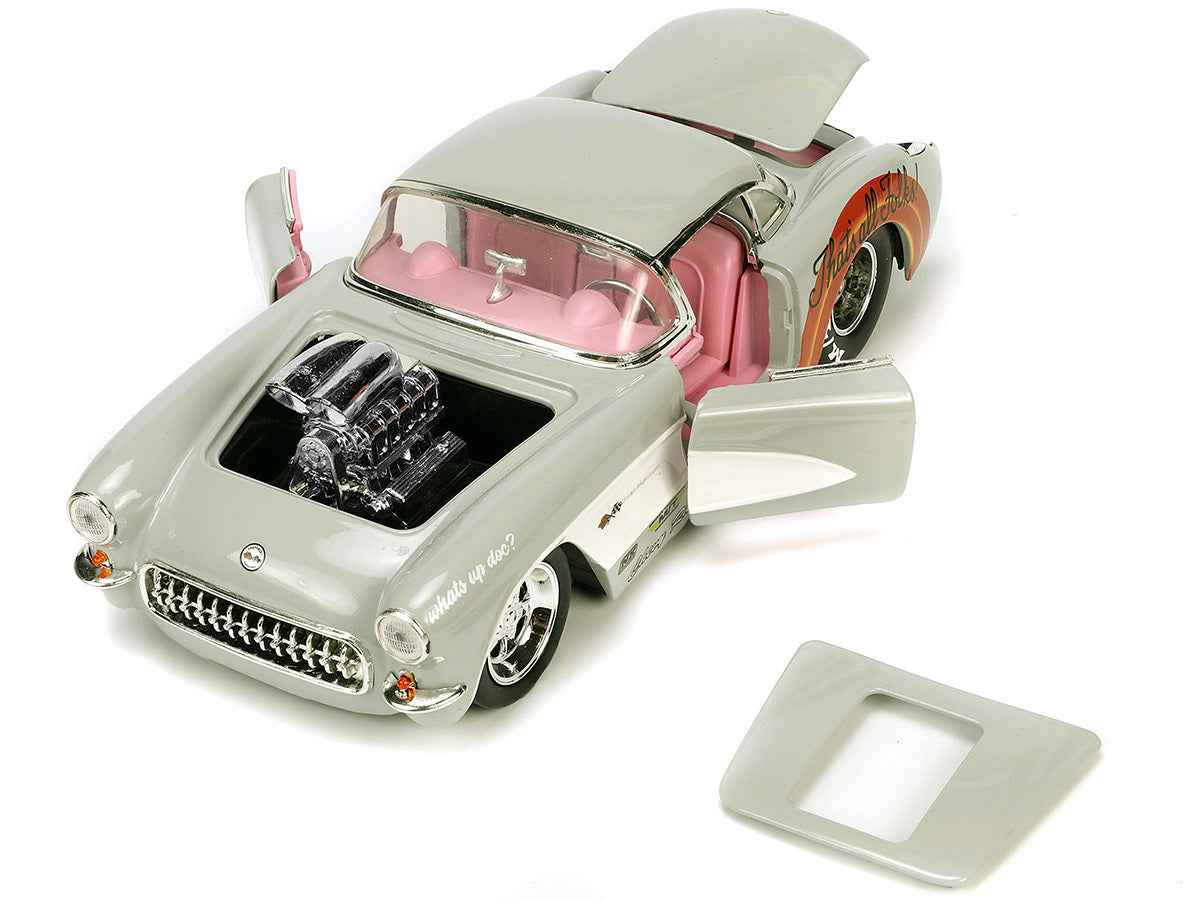 Miniature Motors 1/24 diecast 1957 Chevrolet Corvette model in beige with pink interior and Bugs Bunny figure from Hollywood Rides series.
