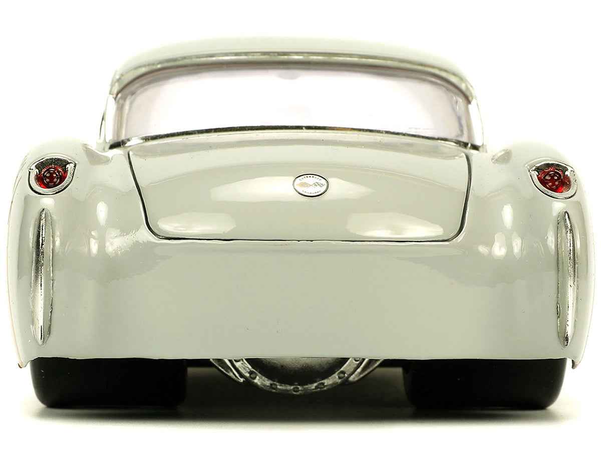 Miniature Motors 1957 Chevrolet Corvette diecast model in beige with pink interior and Bugs Bunny figure, Hollywood Rides series.