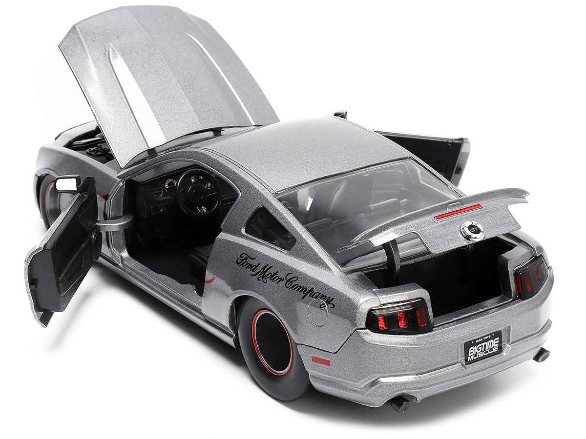2010 Ford Mustang GT Gray Metallic diecast model car with flame design by Jada, part of Miniature Motors Bigtime Muscle series.