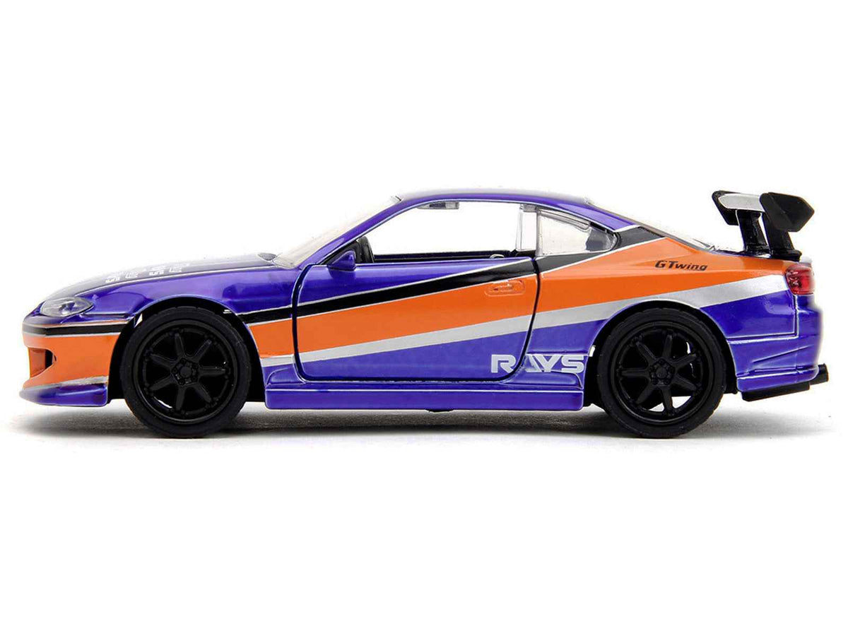 Blue metallic 2001 Nissan Silvia S15 diecast model by Miniature Motors, featuring graphics from The Fast and the Furious: Tokyo Drift.