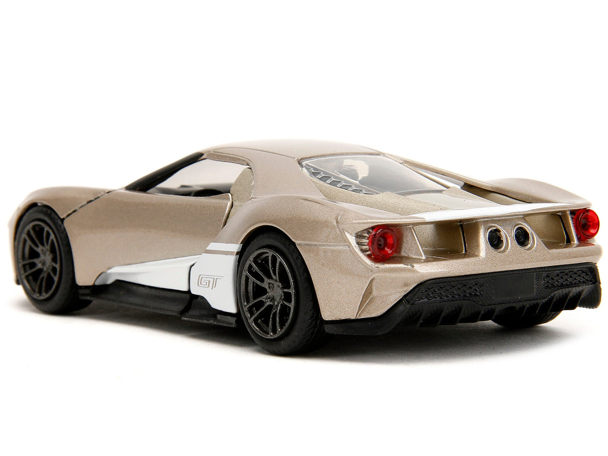 2017 Ford GT diecast model car in gold metallic with white accents, part of Jada's Pink Slips Series, 1/32 scale by Miniature Motors.
