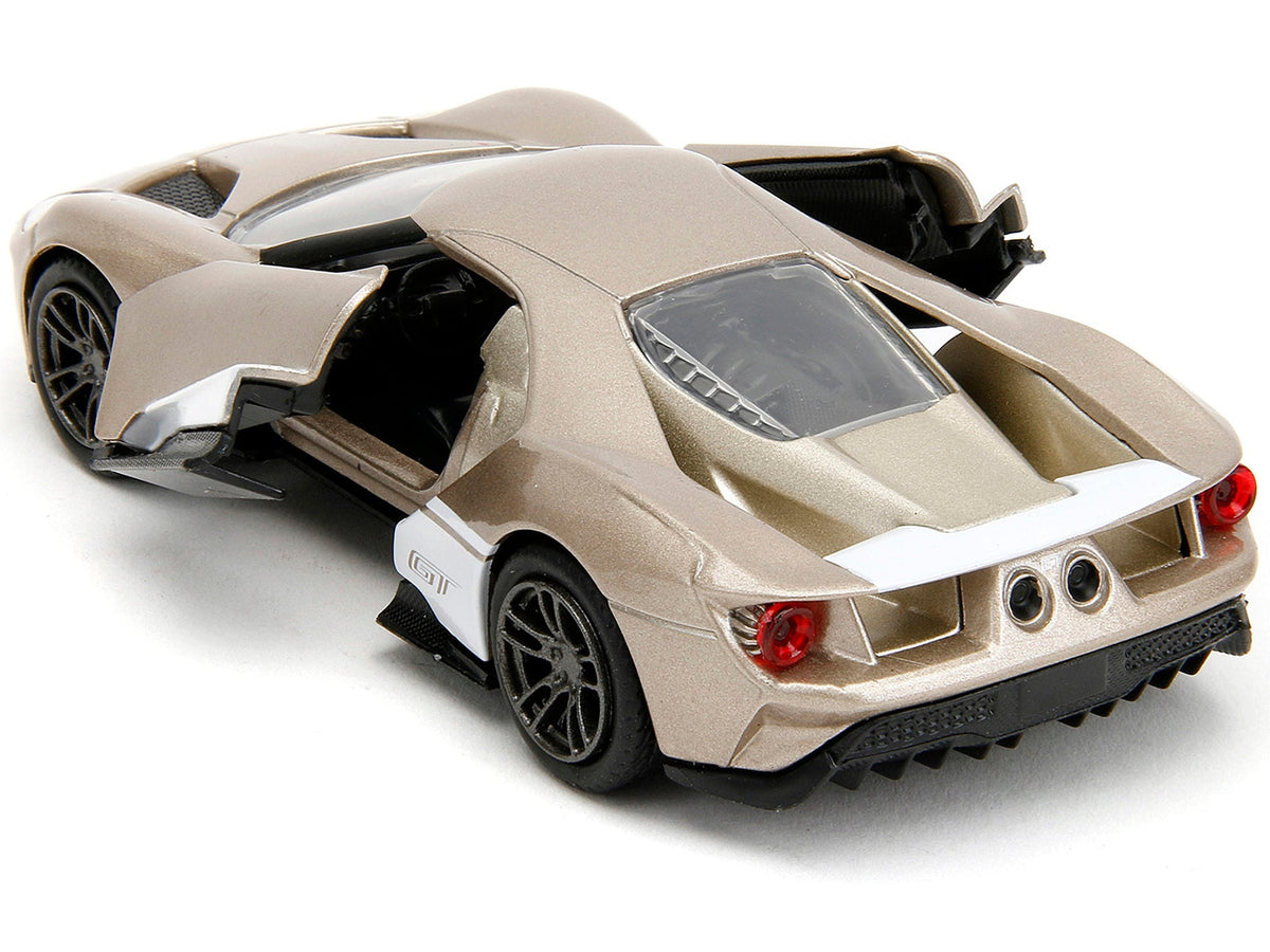 2017 Ford GT gold metallic diecast model car with white accents, part of Jada's Pink Slips Series, 1/32 scale by Miniature Motors.