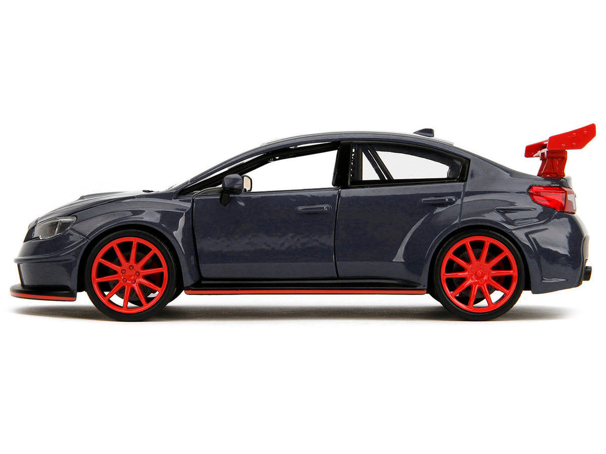 Dark blue 2016 Subaru WRX STI widebody diecast model by Miniature Motors, with Yuji Itadori figure from Jujutsu Kaisen TV series.