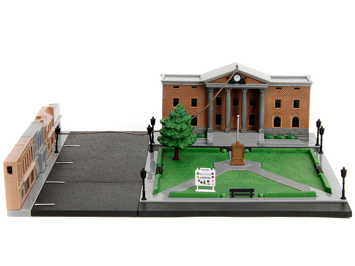 Miniature Motors Back to the Future Hill Valley Courthouse diorama with black pickup truck and DeLorean model from Nano Scene series