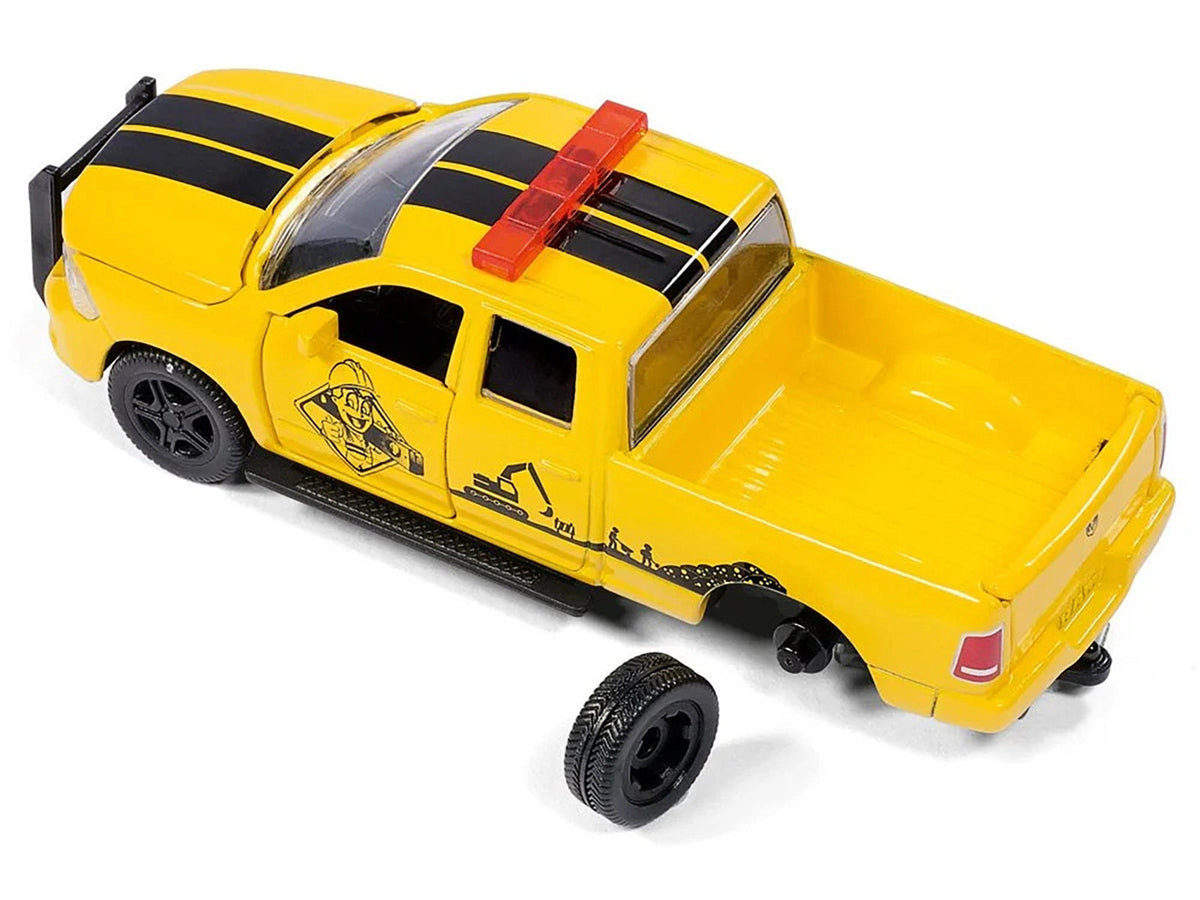 Yellow RAM 1500 pickup truck diecast model by Miniature Motors with compressor trailer, worker figure, and accessories set.