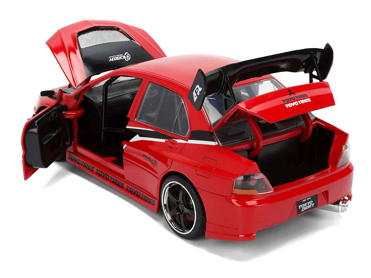 Miniature Motors Mitsubishi Lancer Evolution IX RHD diecast model car in red with "Fast & Furious" graphics, 1/24 scale, detailed replica.