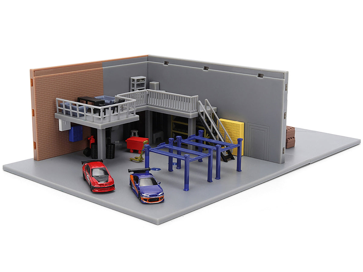 Miniature Motors "Fast & Furious" Han's Garage diorama with two cars and accessories, 1/32 scale movie model by Jada.