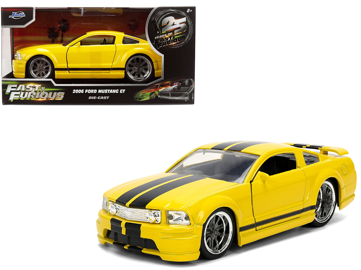 2006 Ford Mustang GT diecast model car in yellow with black stripes, part of Jada's Fast & Furious 25 Years series, Miniature Motors.
