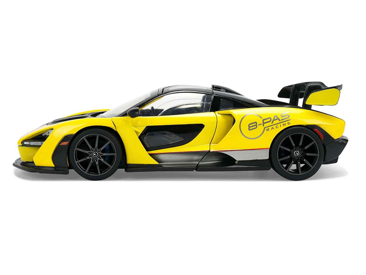Yellow metallic McLaren Senna 1/24 diecast model car with black top, part of Jada's Hyper-Spec series, by Miniature Motors.