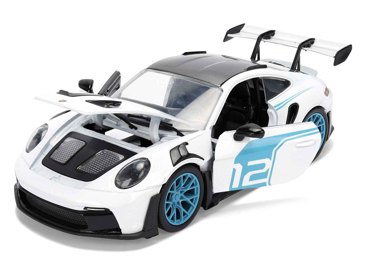 Miniature Motors Porsche 911 GT3 RS (992) diecast model car, white with blue stripes and carbon top, detailed 1/24 scale.