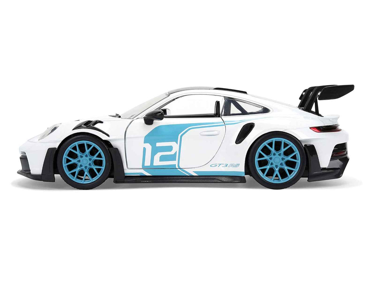 Miniature Motors Porsche 911 GT3 RS (992) diecast model car in white with blue stripes and carbon top, 1/24 scale.