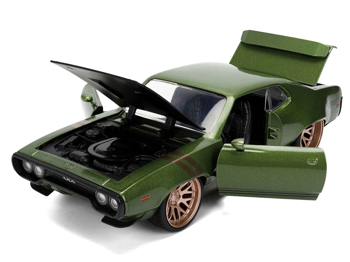 1972 Plymouth GTX diecast model car by Miniature Motors, green metallic finish with matte black hood and gold stripes.