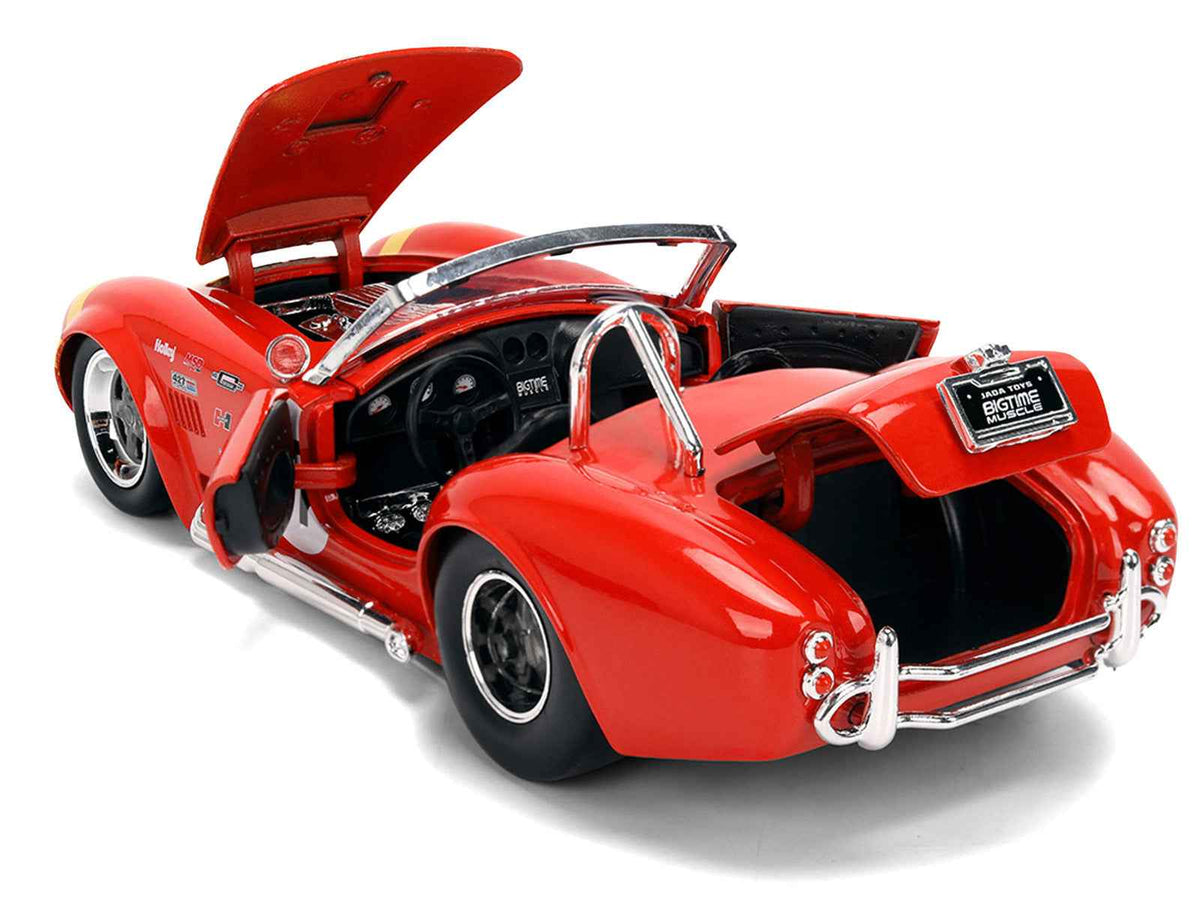 Red 1965 Shelby Cobra 427 S/C #67 diecast model car with yellow stripe, part of Miniature Motors' Bigtime Muscle series.