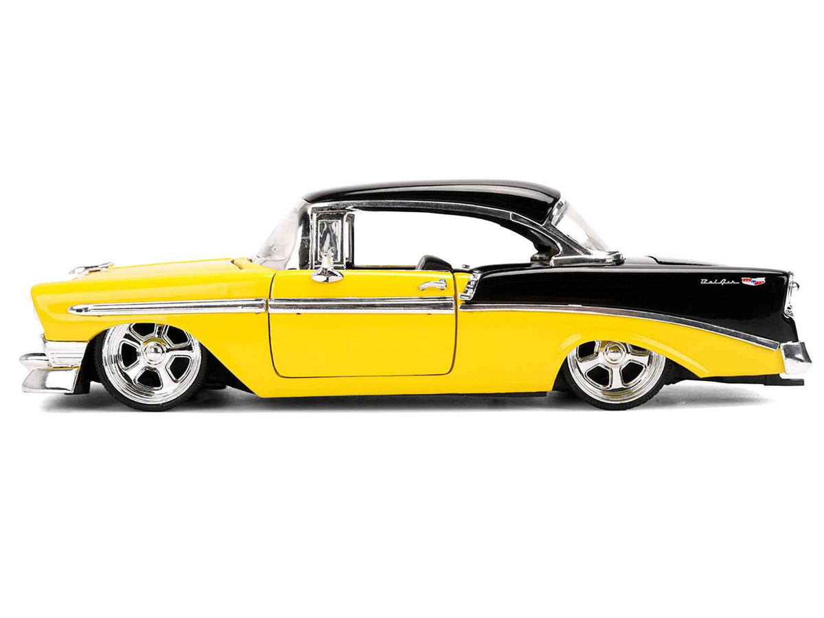 Yellow and black 1956 Chevrolet Bel Air diecast model car by Jada from the Bigtime Muscle Series, detailed miniature Chevrolet model.