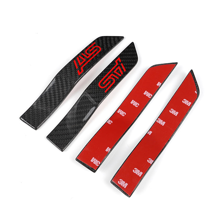 JDMuscle Tanso Carbon Fiber Fender Emblem V2 for 2015-2021 WRX/STI, close-up of sleek black carbon fiber emblem on car fender.