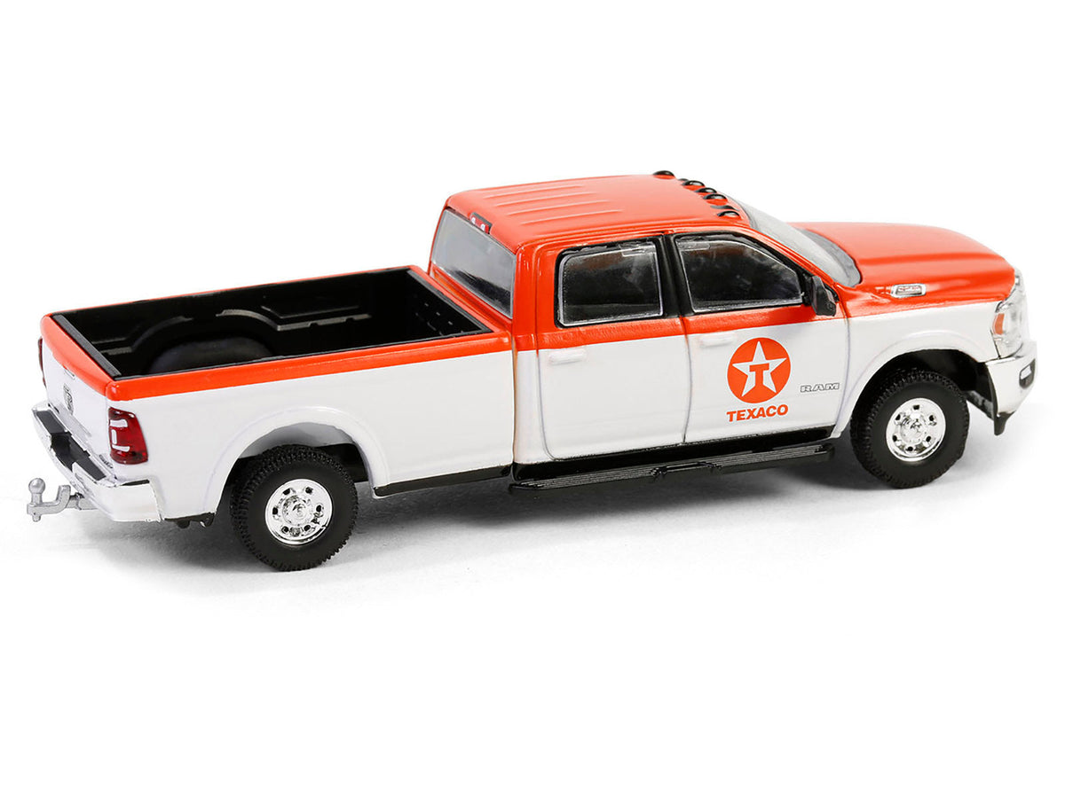 Orange and white 2023 Ram 2500 Texaco Special Edition diecast model truck by Greenlight, detailed miniature pickup truck.