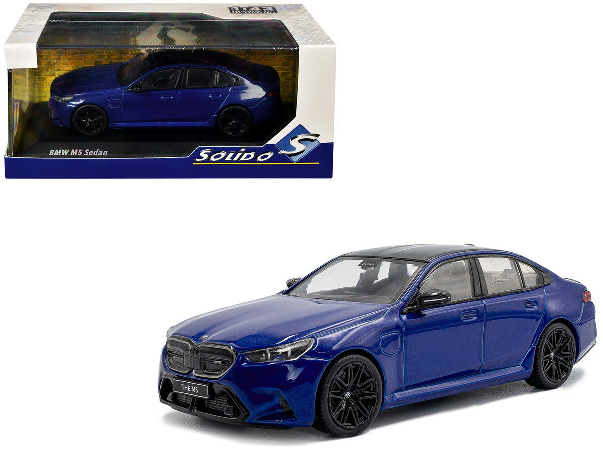 Miniature BMW M5 Sedan diecast model in Marina Bay Blue Metallic with black top, by Solido, 1/43 scale.