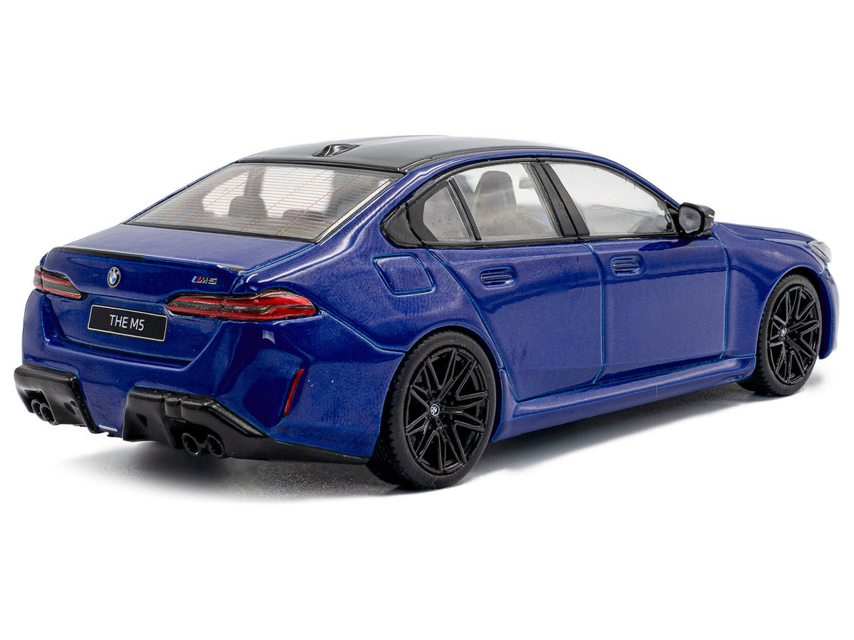 Miniature Motors 2024 BMW M5 Sedan diecast model in Marina Bay Blue Metallic with black roof, detailed 1/43 scale car by Solido.
