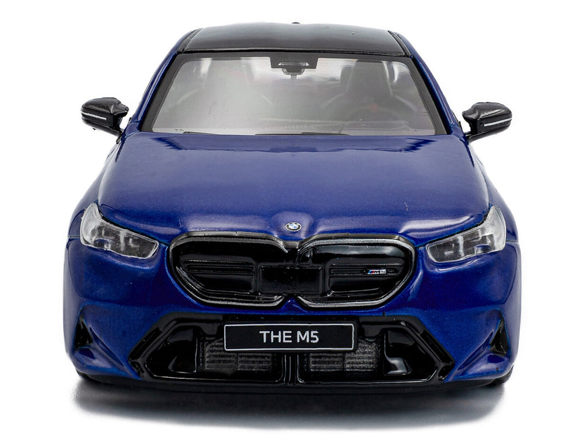 Miniature BMW M5 Sedan diecast model in Marina Bay Blue metallic with black roof, detailed 1/43 scale by Solido.