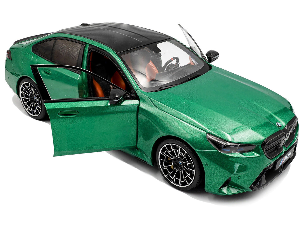 Miniature BMW M5 diecast model car in Isle of Man Green Metallic by Solido, detailed 1/18 scale collectible from Miniature Motors.
