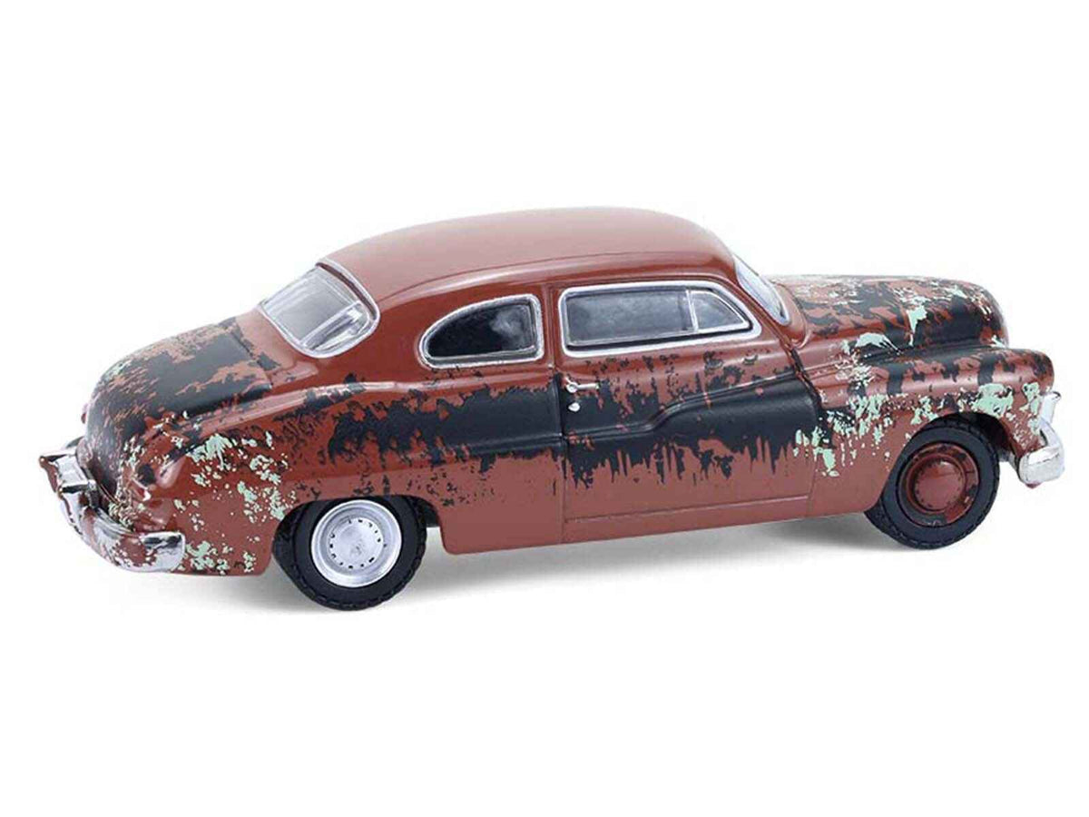 Miniature Motors 1/64 diecast model of 1949 Mercury Eight "Barn Find" in brown rust finish from Greenlight's Series 11.