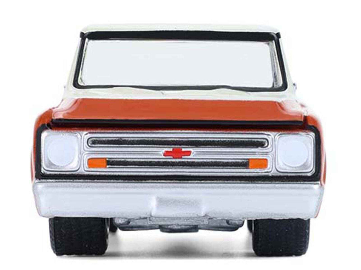 Miniature Motors 1968 Chevrolet C-10 Pickup Truck diecast model in orange and beige, "Down on the Farm" Series, 1/64 scale.