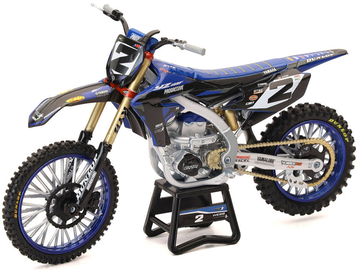 Miniature Yamaha YZ450F motorcycle diecast model by New Ray, featuring Cooper Webb and Yamaha Factory Racing branding.