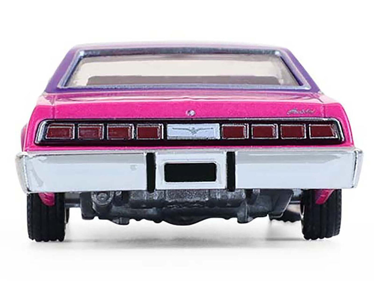 Miniature Motors 1/64 diecast model of 1975 Ford Thunderbird lowrider in pink metallic with purple top, graphics, and interior.