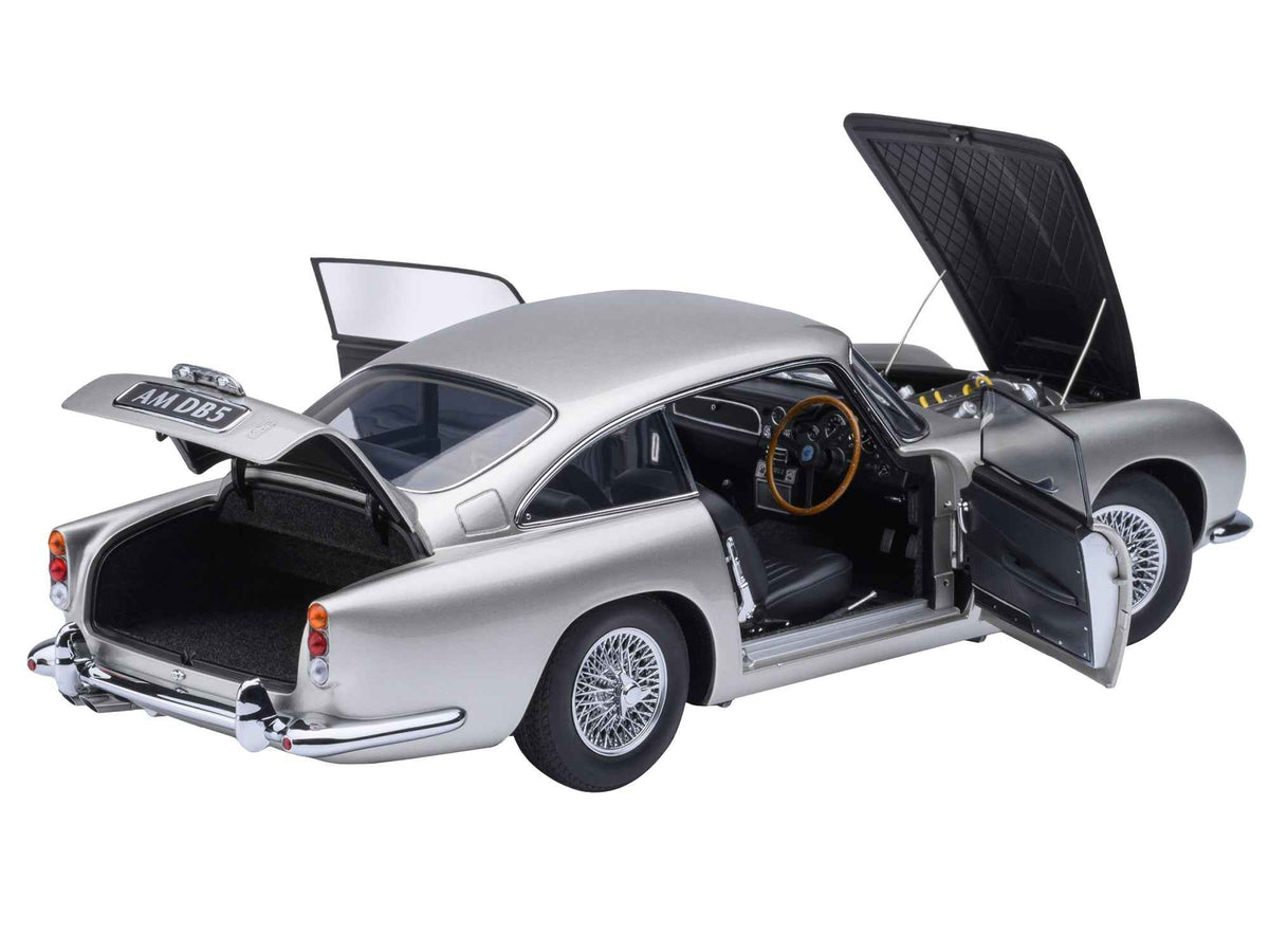 Miniature Motors Aston Martin DB5 RHD model car in Birch Silver, 1/18 scale by Autoart, detailed right-hand drive collectible.