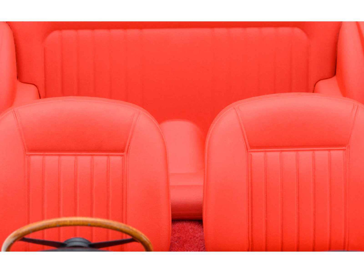 Miniature Aston Martin DB5 RHD model car in Dubonnet Rosso Red Metallic by Autoart, detailed 1/18 scale collectible.