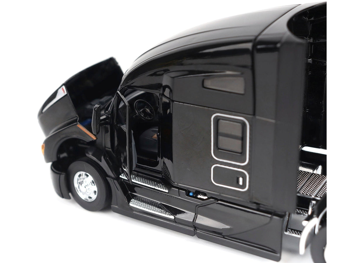 Black Kenworth T680 76" High Roof Sleeper Cab diecast model by Diecast Masters, detailed miniature truck tractor.