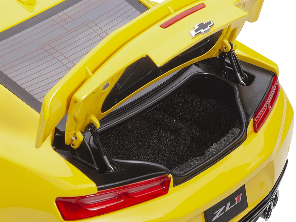 Bright yellow Chevrolet Camaro ZL1 1/18 scale model car by Autoart, detailed miniature Chevrolet model in a realistic display.