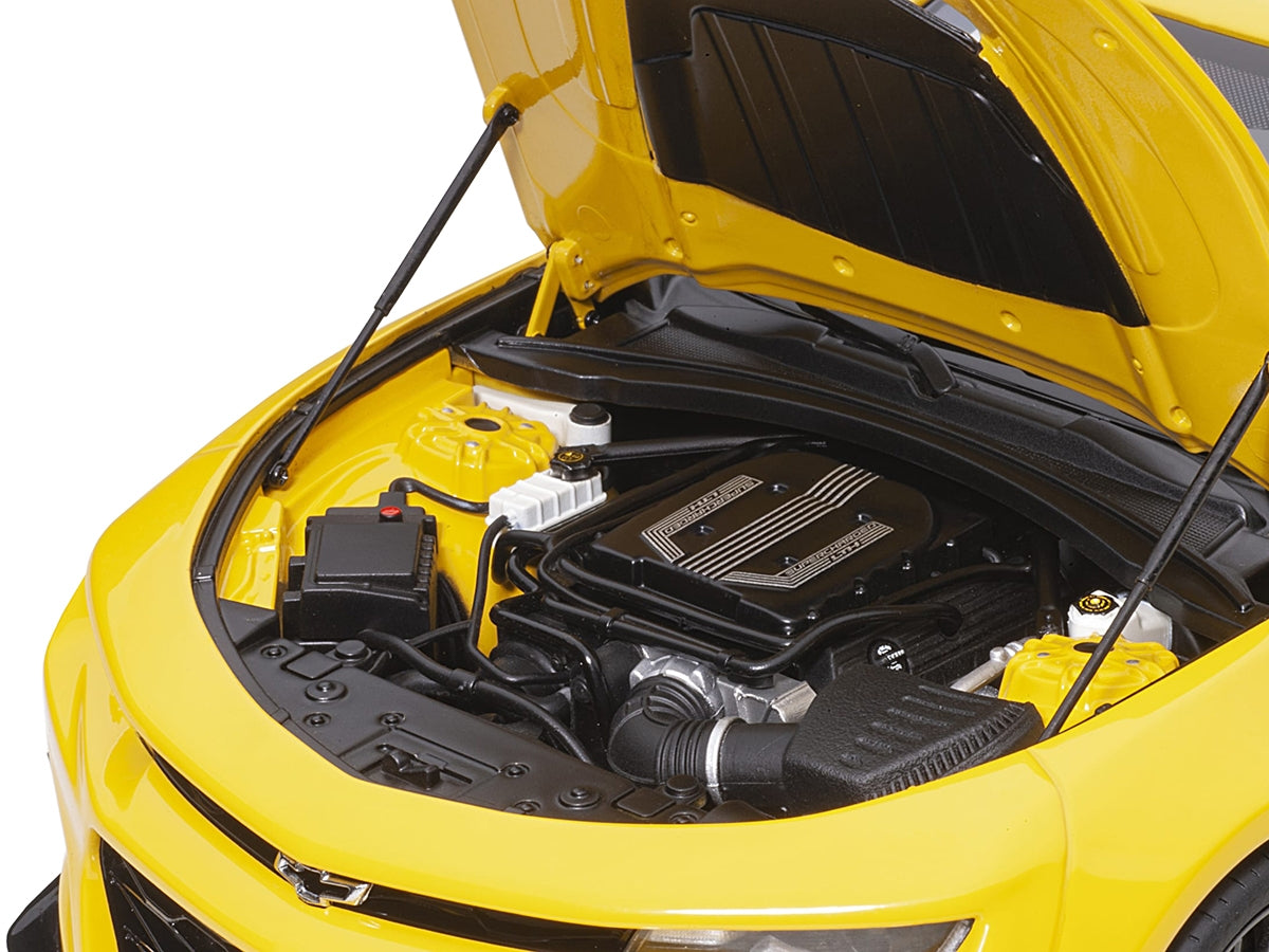 Bright yellow Chevrolet Camaro ZL1 1/18 scale model car by Autoart, detailed miniature Chevrolet model in a realistic display.
